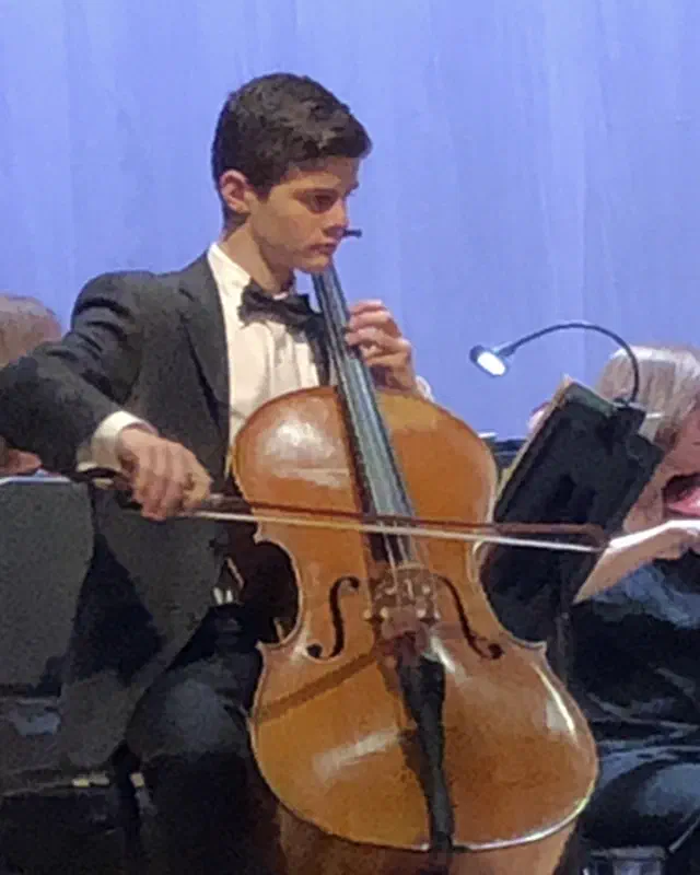 AJ La Barca performing as cello soloist with orchestra